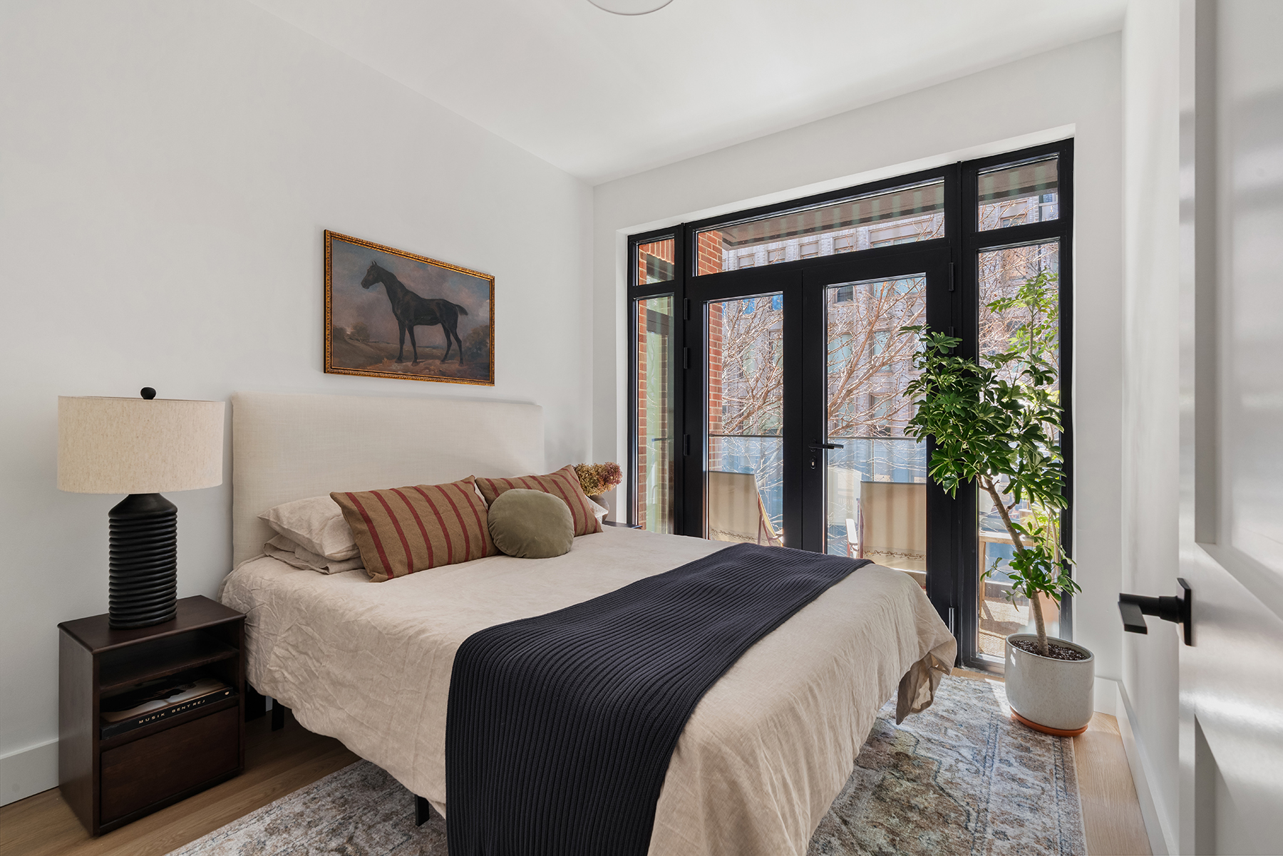 Second bedroom with warm natural light